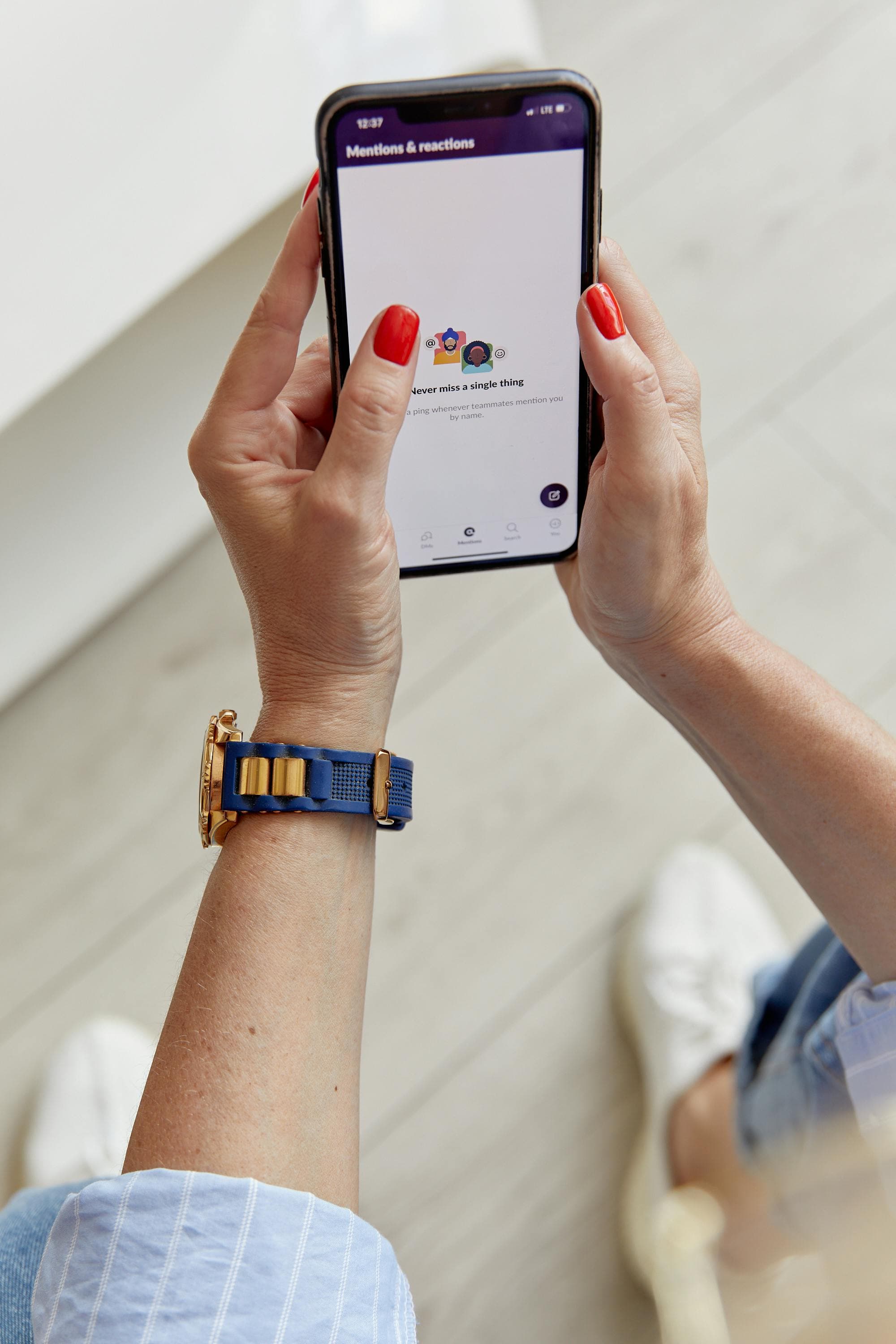 Person holding a phone with a messaging screen
